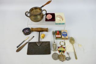 A mixed lot of collectables to include plated ware, silver handled tweezers, 1976 $1 Dollar coin,