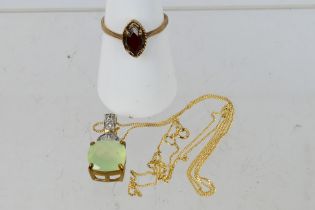 A 9ct yellow gold stone set pendant on chain stamped 10k, 46 cm (l) and a 9ct rose gold ring,