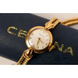 A lady's 9ct gold cased Certina wrist watch on 9ct gold bracelet, approximately 15.