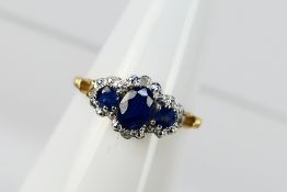 A 9ct yellow gold sapphire and diamond ring, size N+½, approximately 1.8 grams.