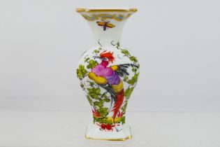 A small Chelsea style vase decorated with exotic bird and flowers, gold anchor mark to the base,