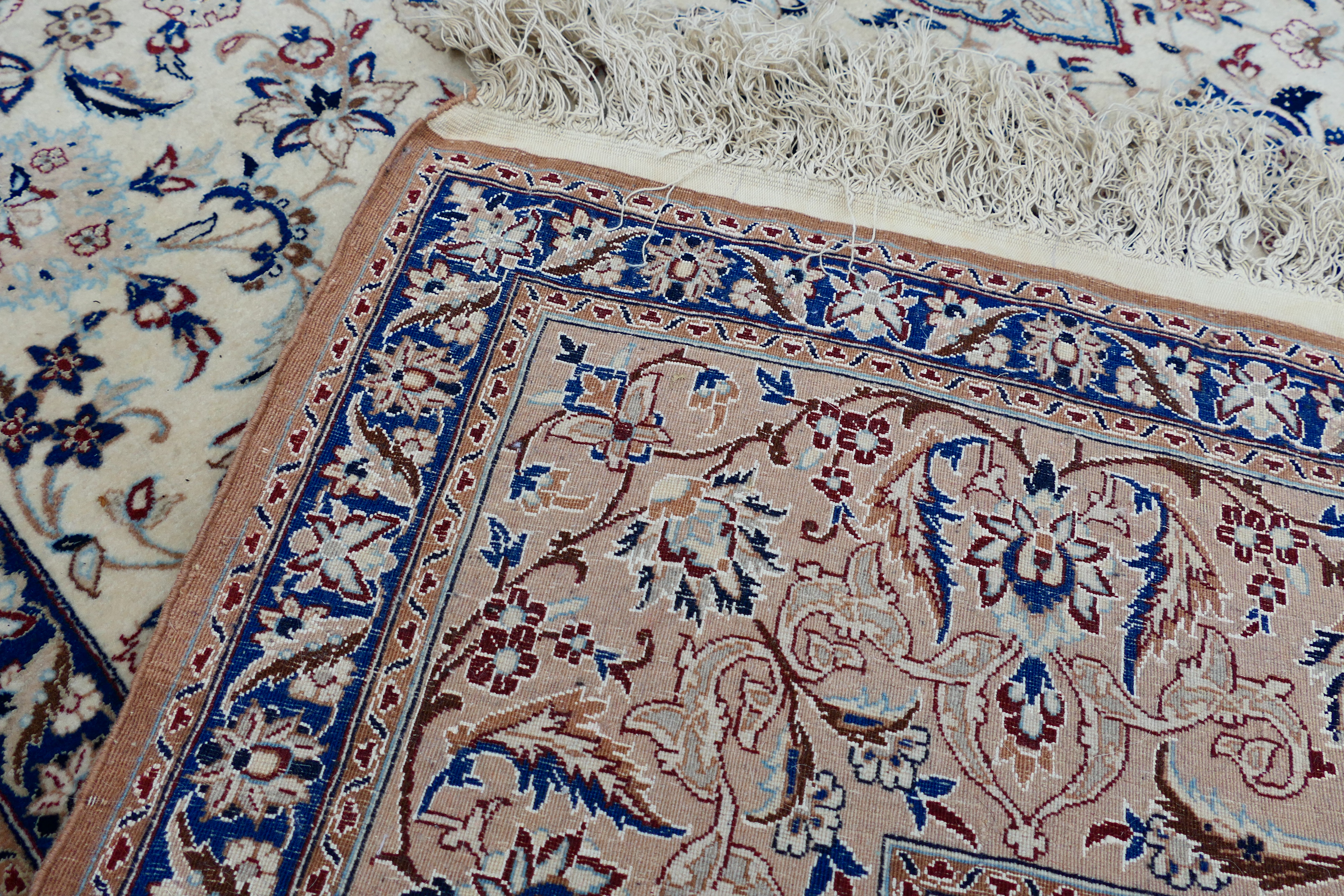 A Persian ivory ground rug with central medallion on a floral field, with foliage scroll border, - Image 7 of 14