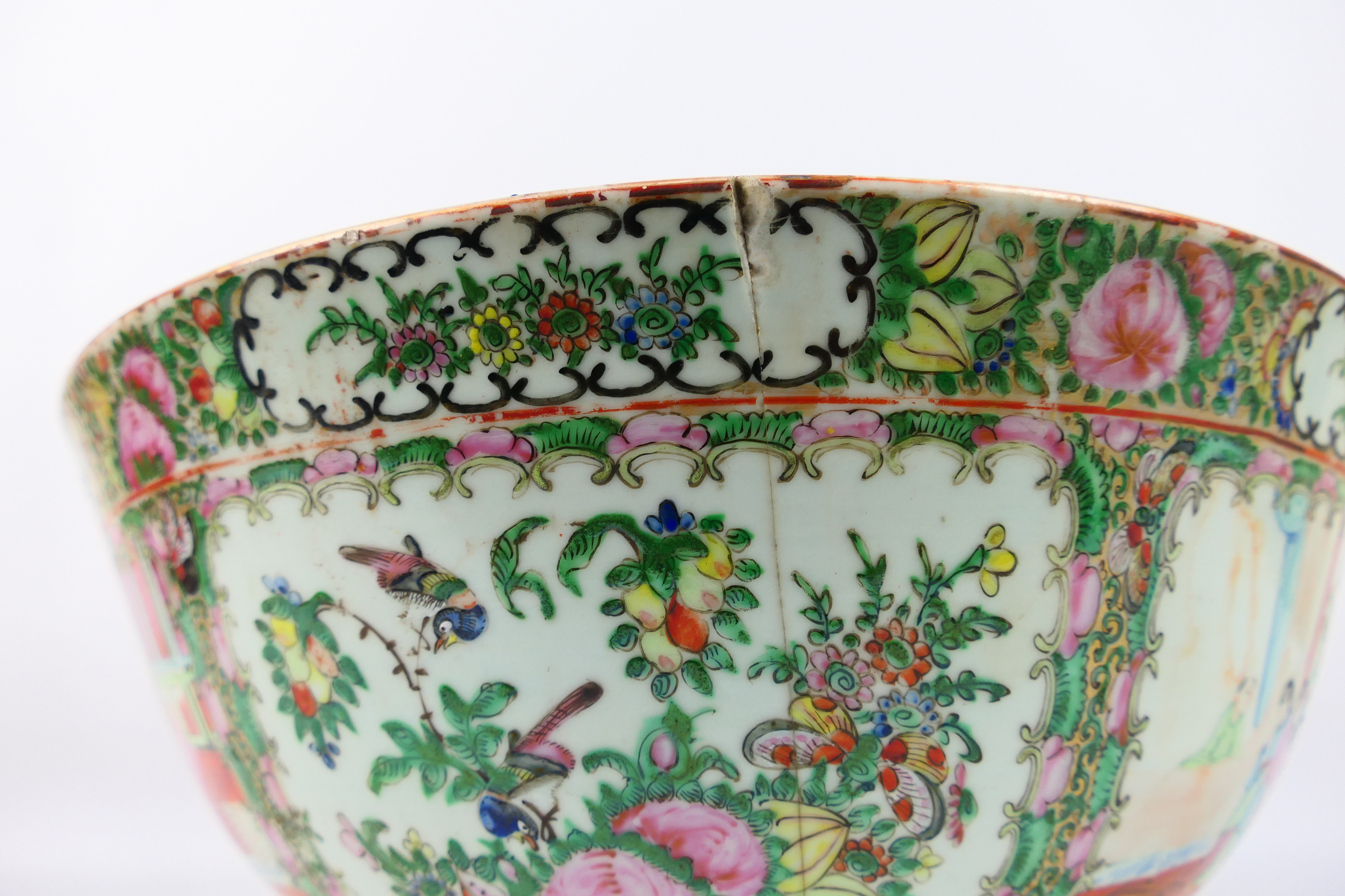 A large Cantonese famille rose punch bowl, typically decorated with panels of figures and flora, - Image 7 of 9