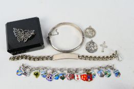 A collection of silver and white metal jewellery comprising an identity bracelet (hallmarked),
