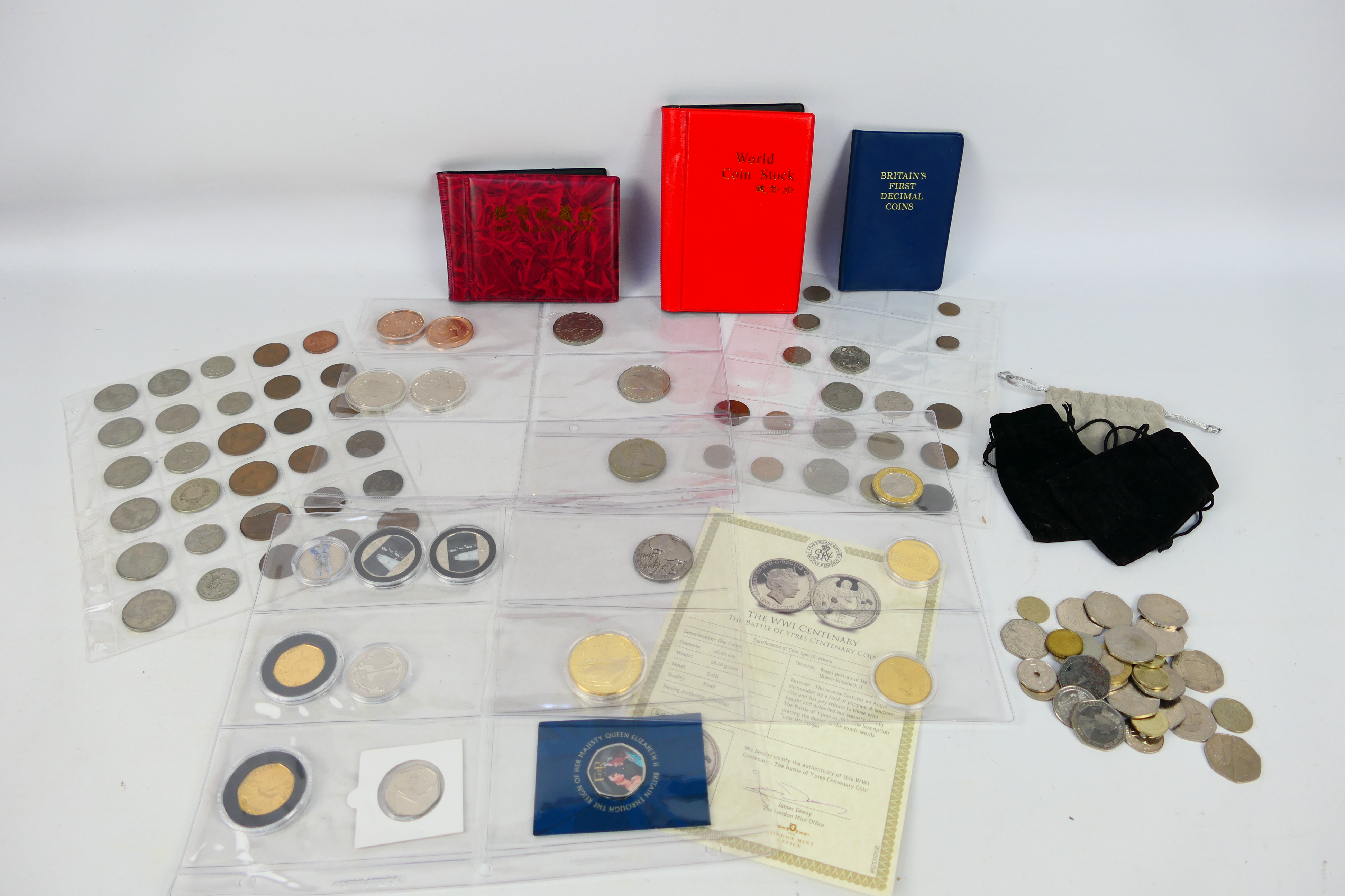 A collection of UK and foreign coins to include collectable fifty pence (50p) examples and other.
