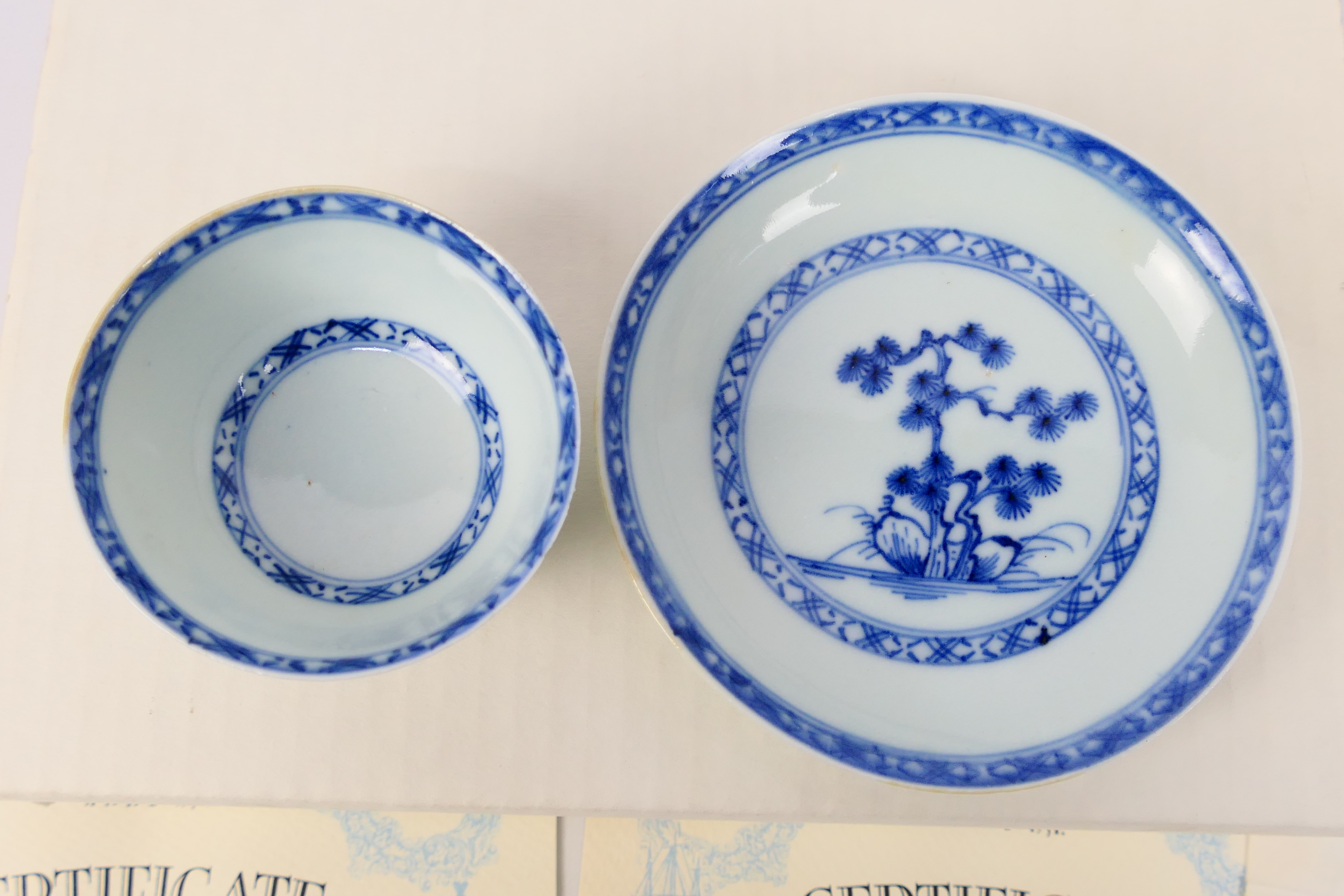 Nanking Cargo - A Qing dynasty blue and white tea bowl and saucer decorated with pine trees, c. - Image 2 of 9
