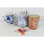 A group of Oriental ceramics to include a blue and white ewer, teapot and other,