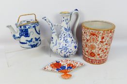 A group of Oriental ceramics to include a blue and white ewer, teapot and other,