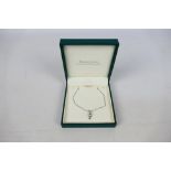 A 9ct white gold diamond set pendant on 9ct white gold chain (44 cm length),