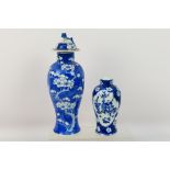 A Chinese blue and white jar and cover, decorated with prunus,