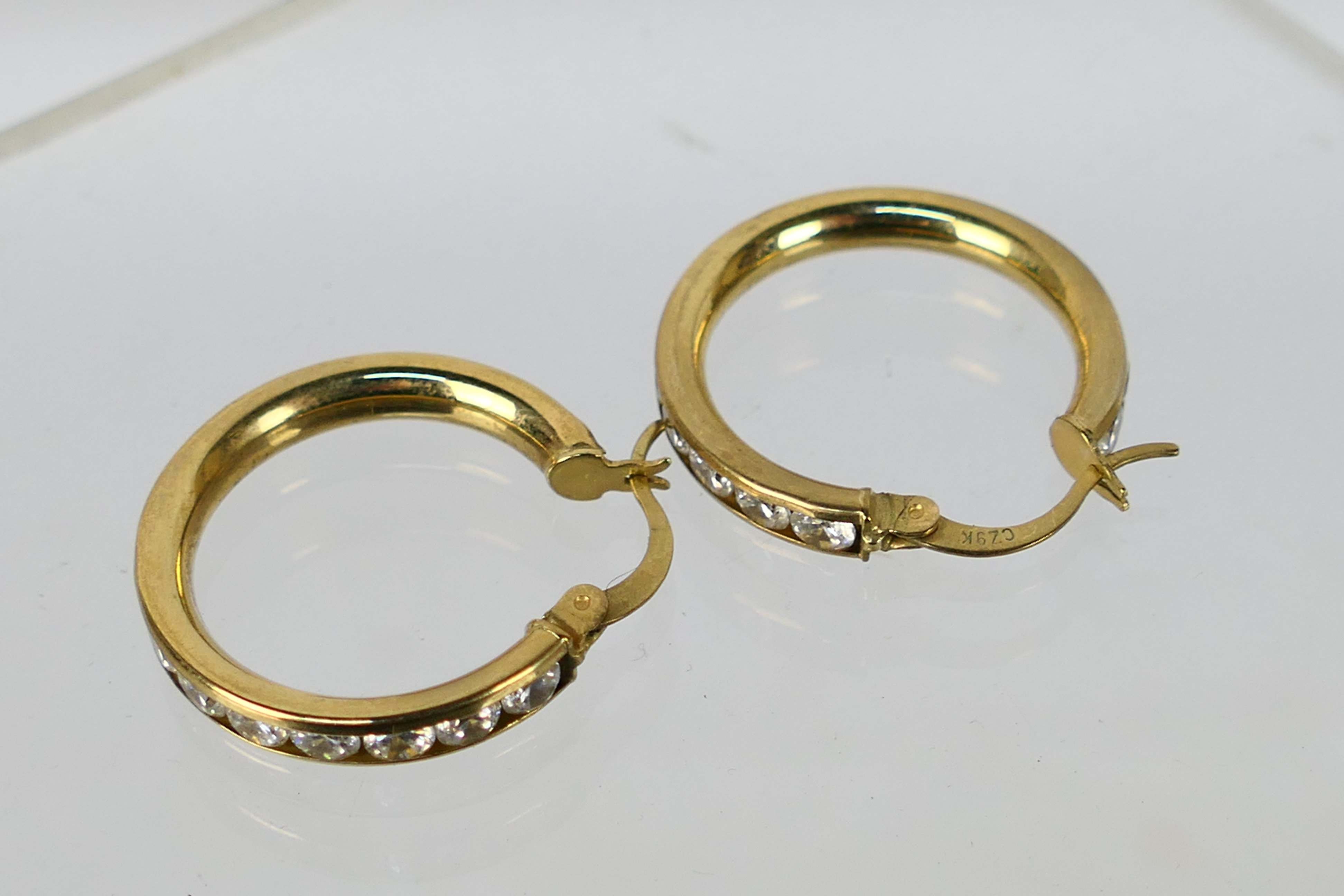 A pair of 9ct yellow gold, stone set ear hoops, approximately 3.7 grams. - Image 3 of 4
