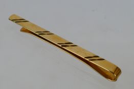 A 9ct yellow gold tie clip, 3.1 grams.