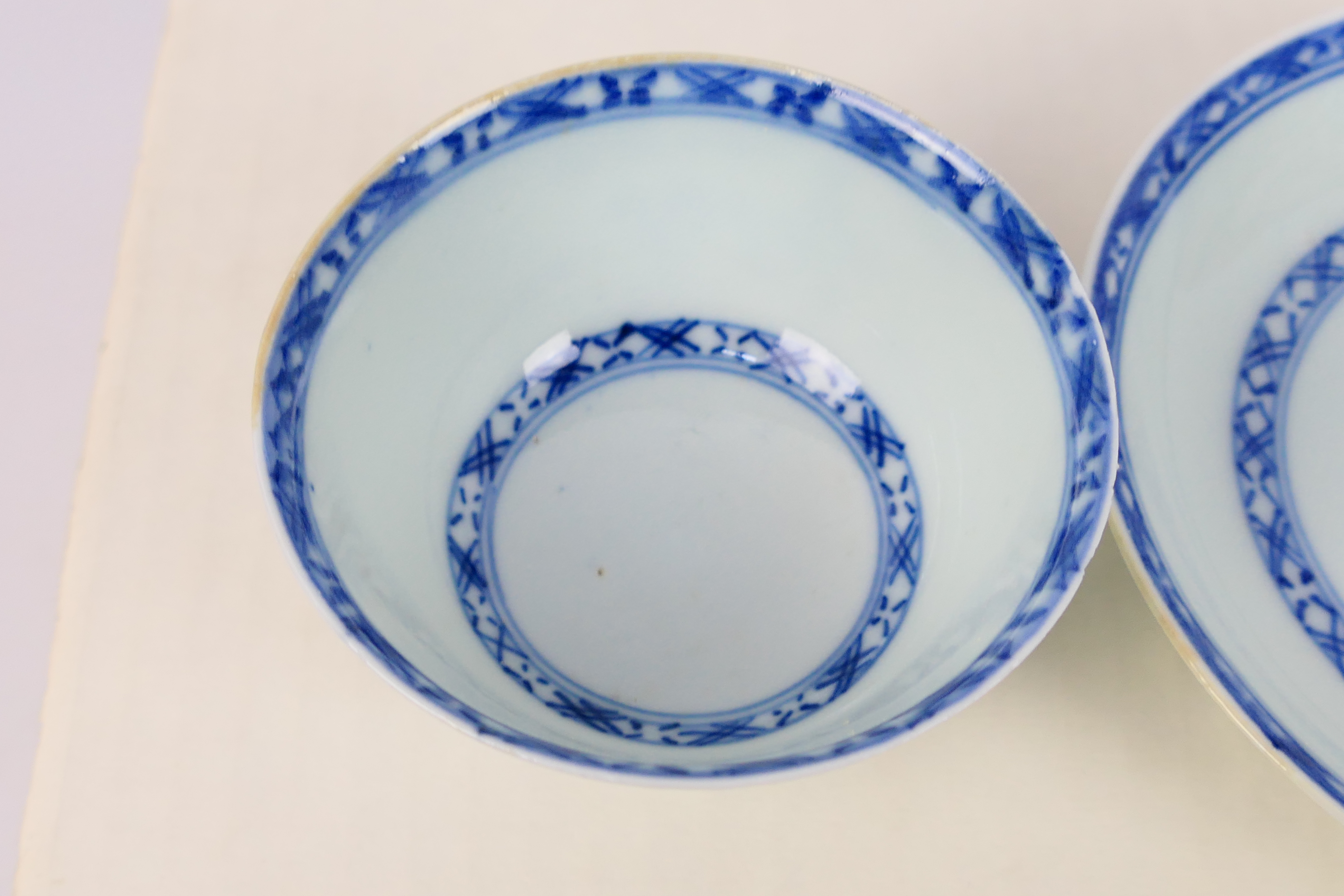 Nanking Cargo - A Qing dynasty blue and white tea bowl and saucer decorated with pine trees, c. - Image 3 of 9