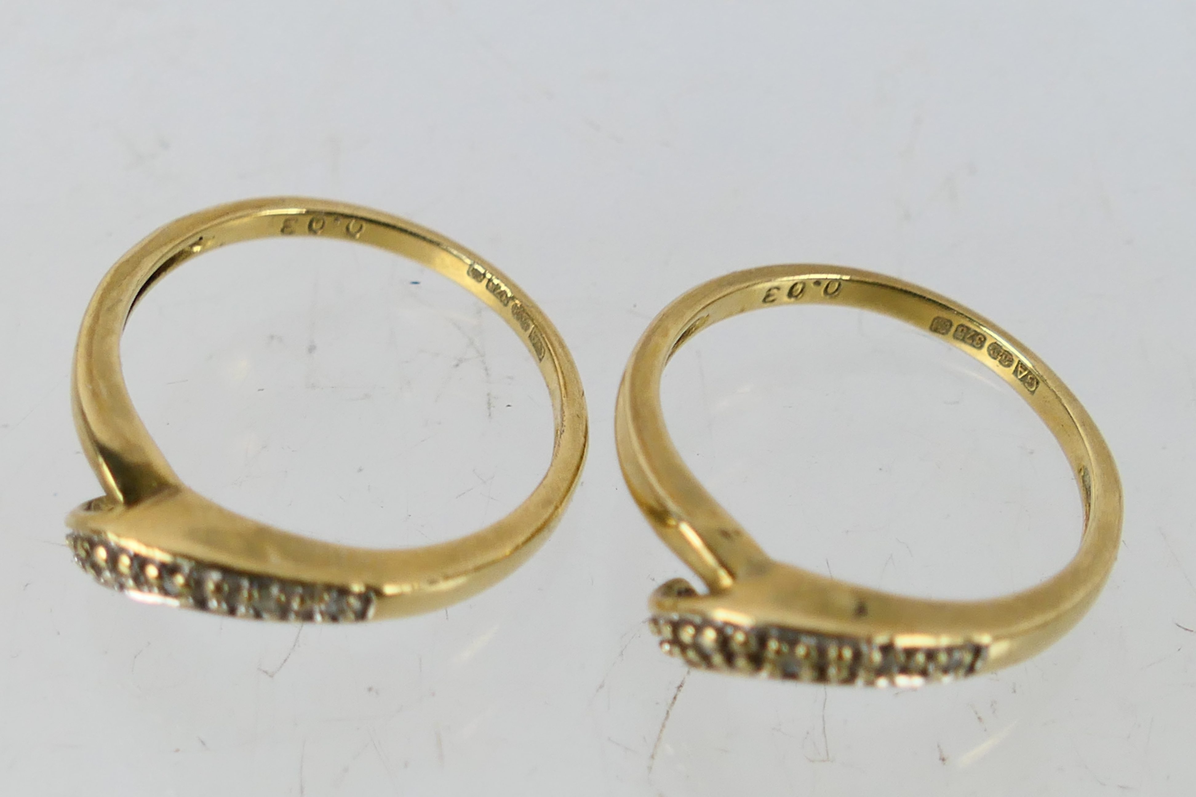 A pair of 9ct yellow gold rings set with diamond chips, size O, approximately 4.9 grams. - Image 4 of 4