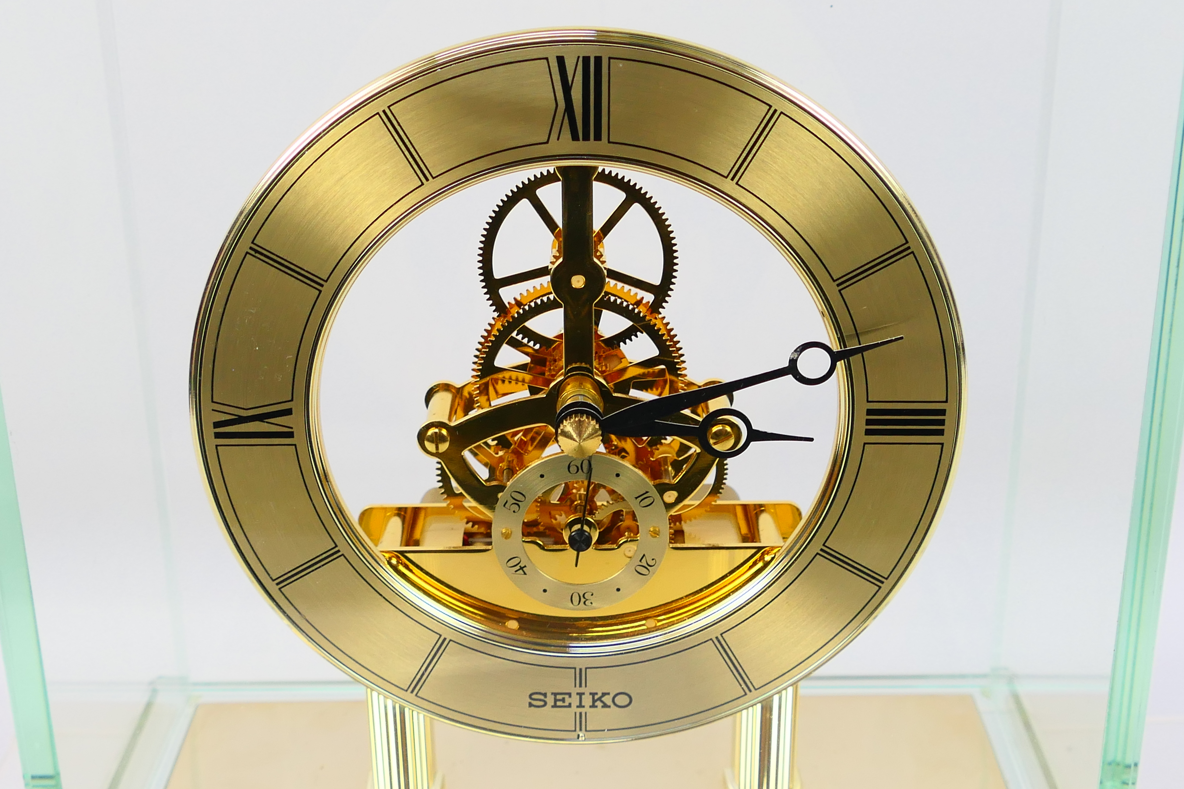 Seiko - A glass cased skeleton clock with quartz movement, 24 cm (h) to top of handle. - Image 2 of 6