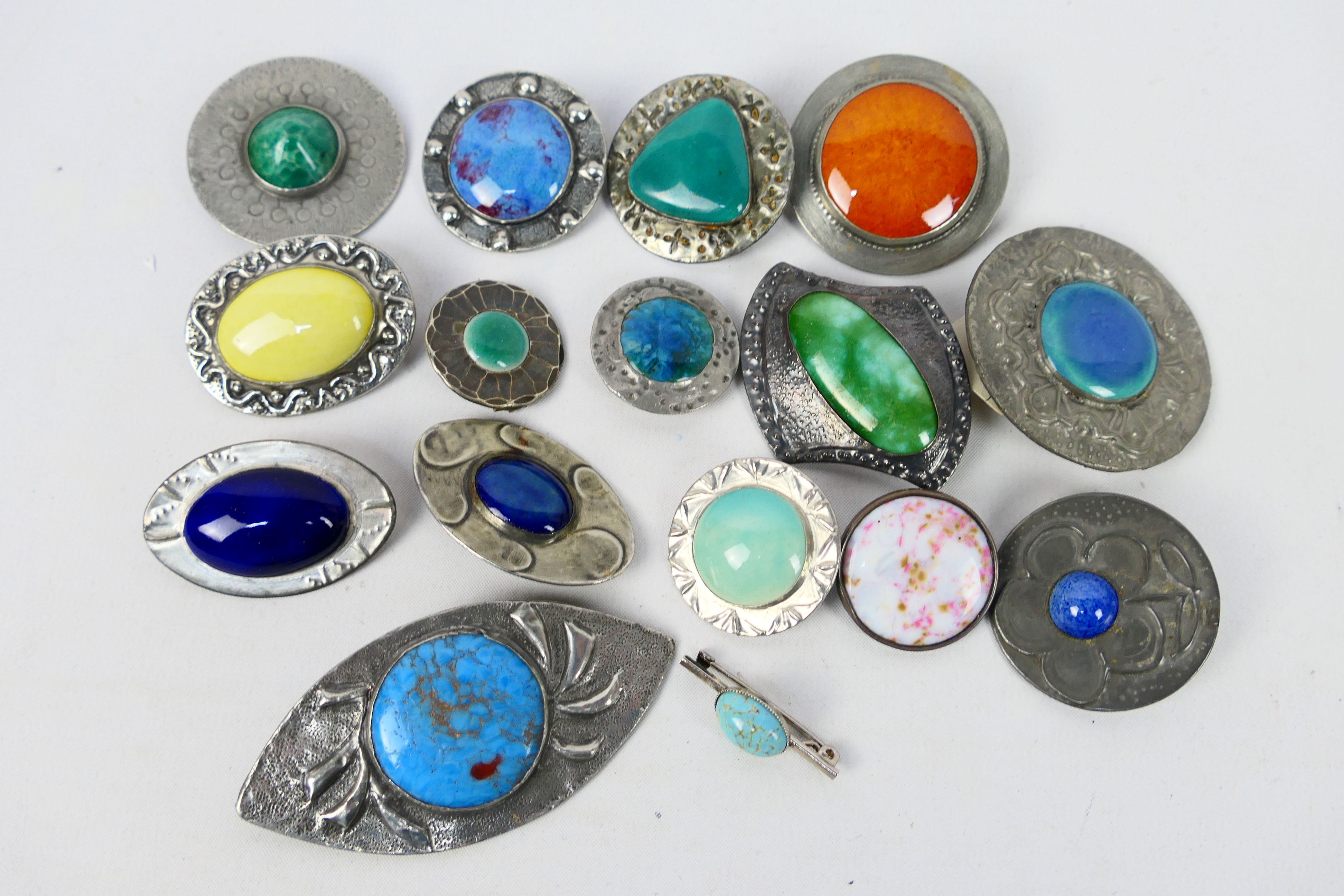 A good collection of Ruskin style brooches.