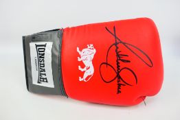 Boxing Interest - A red Lonsdale boxing glove signed by Anthony Joshua,