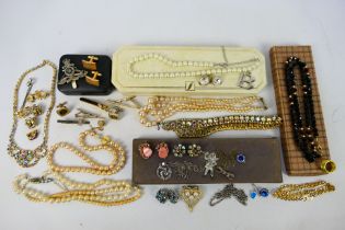 A collection of costume jewellery to include necklaces, earrings, cufflinks and similar.