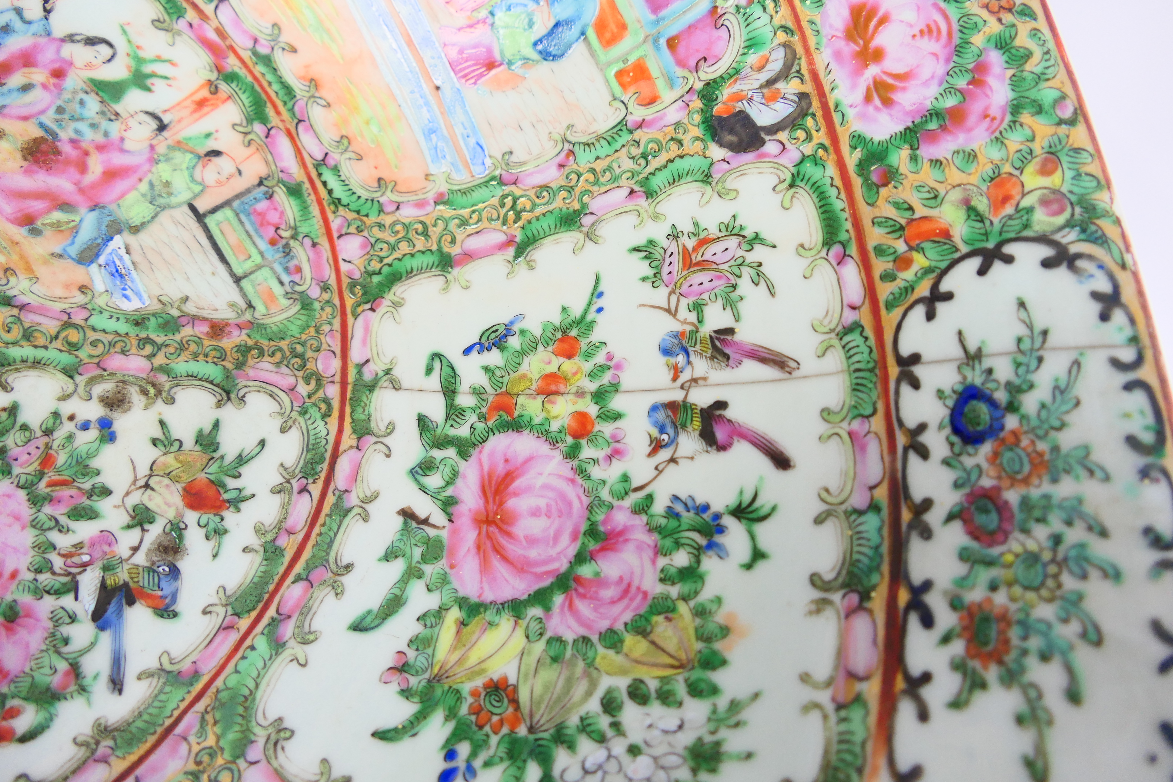 A large Cantonese famille rose punch bowl, typically decorated with panels of figures and flora, - Image 4 of 9