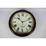 A 12 inch fusee dial clock, dark stained case, white dial marked for GWR and R Jones & Co, Makers,