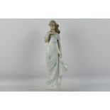 Lladro - A large figure depicting a young lady with a flower, # 6918, A Flower's Whisper,