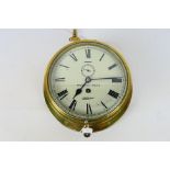 A brass-cased ships bulkhead clock,