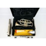 A Boosey & Hawkes Regent cornet numbered 672823, contained in hard case and with music stand. [2].