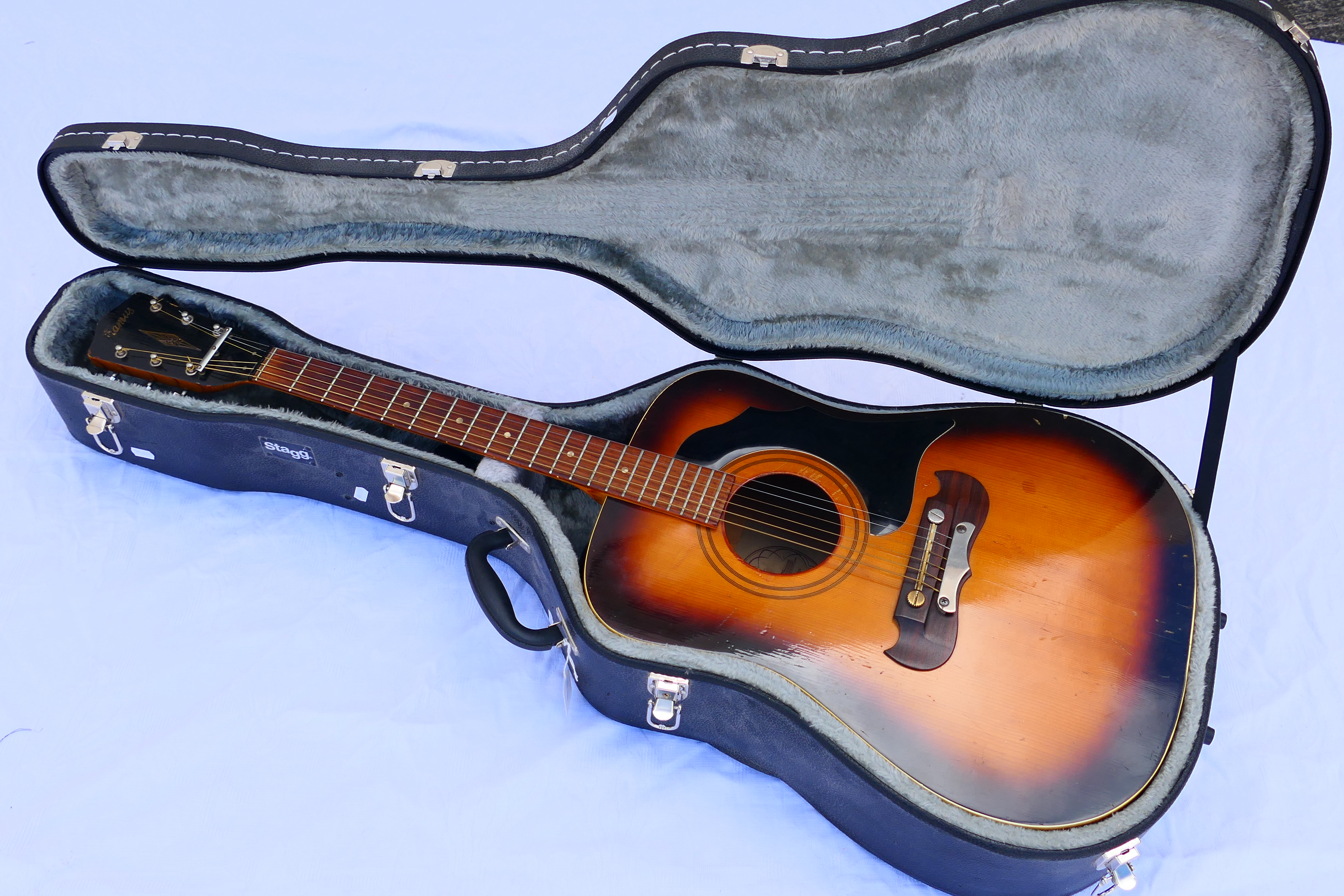 A German Framus acoustic guitar in fitted hard case, model 5/196, serial number 187**.