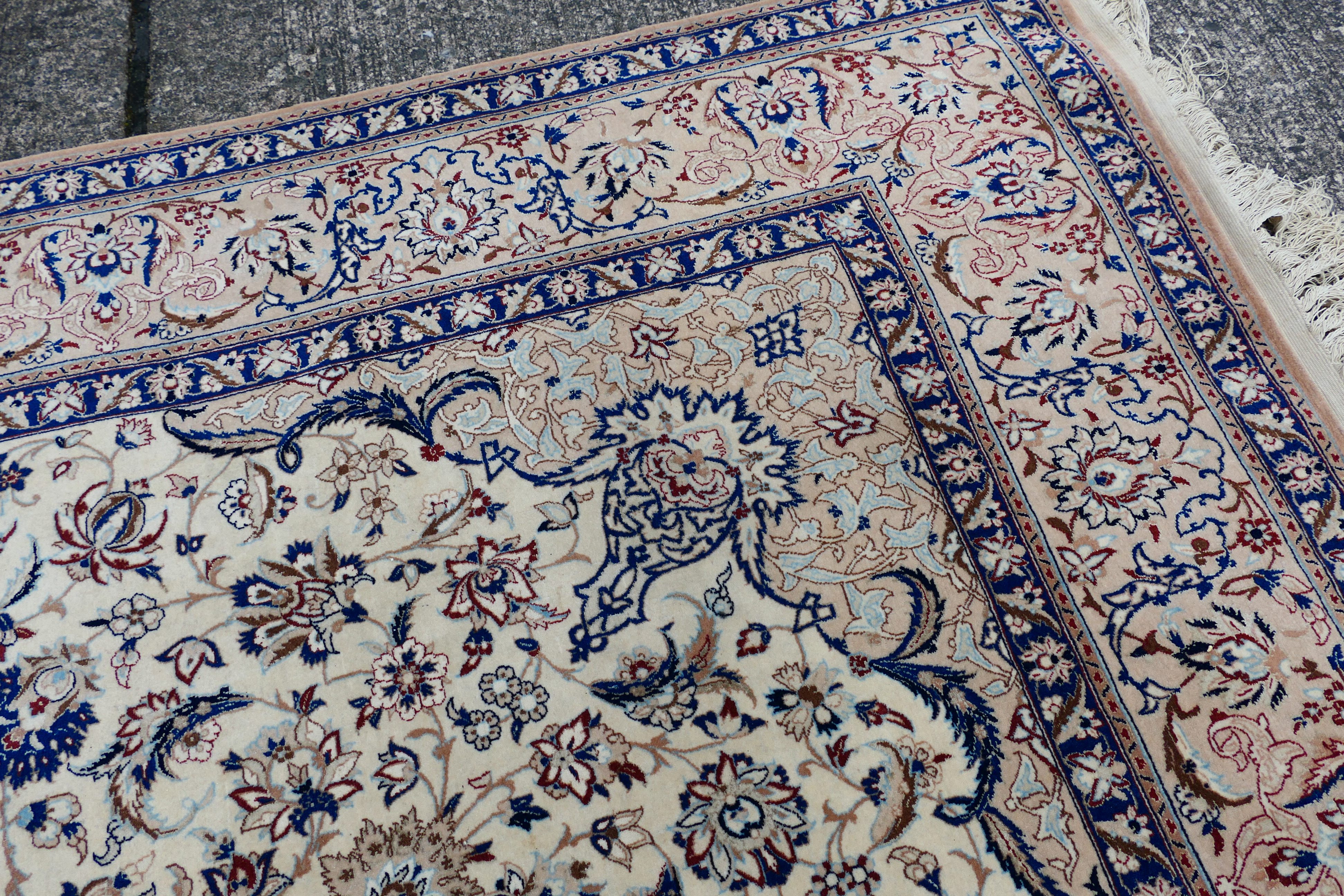 A Persian ivory ground rug with central medallion on a floral field, with foliage scroll border, - Image 6 of 14