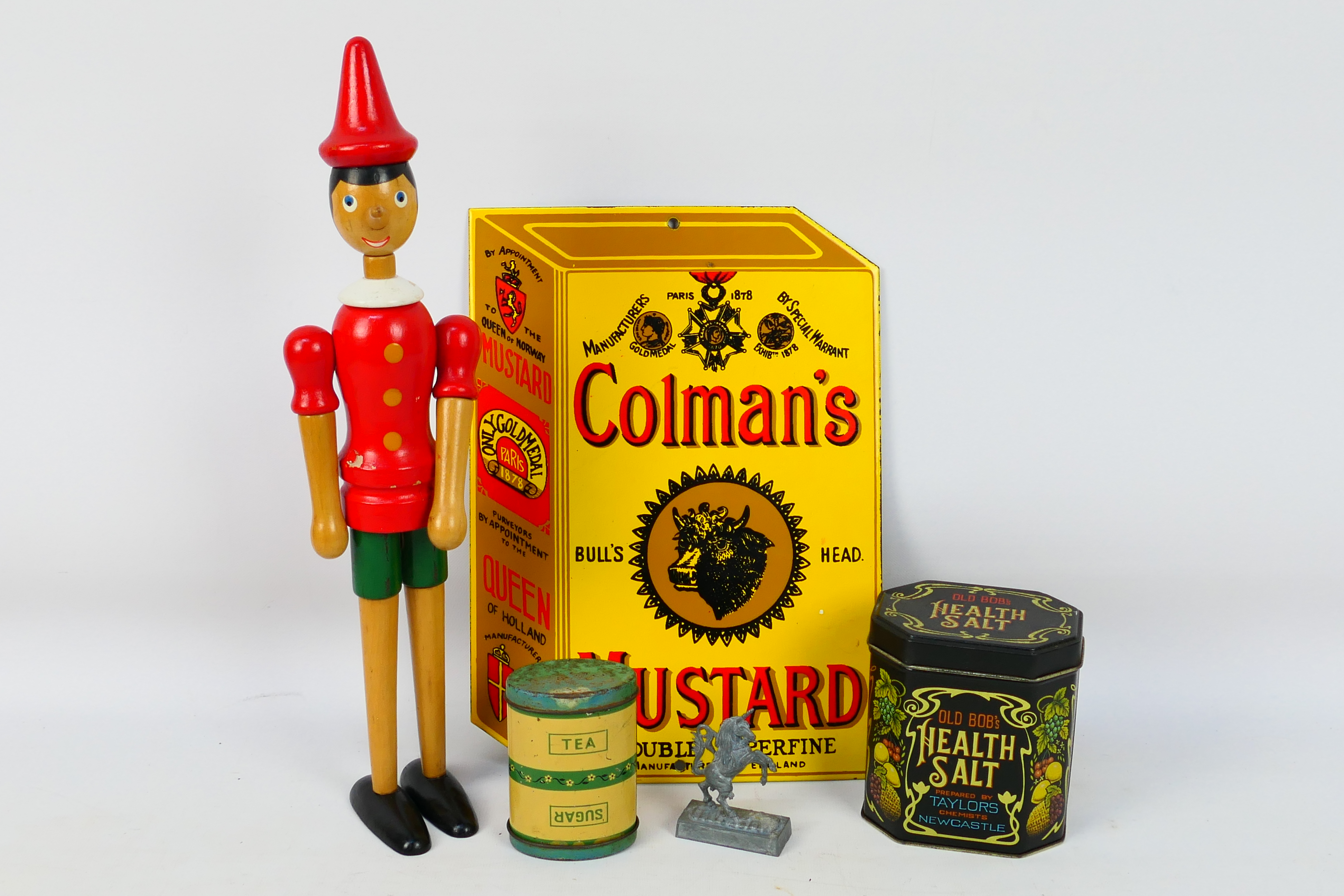 Lot to include a Coleman's Mustard enamel advertising sign, wooden Pinocchio model,