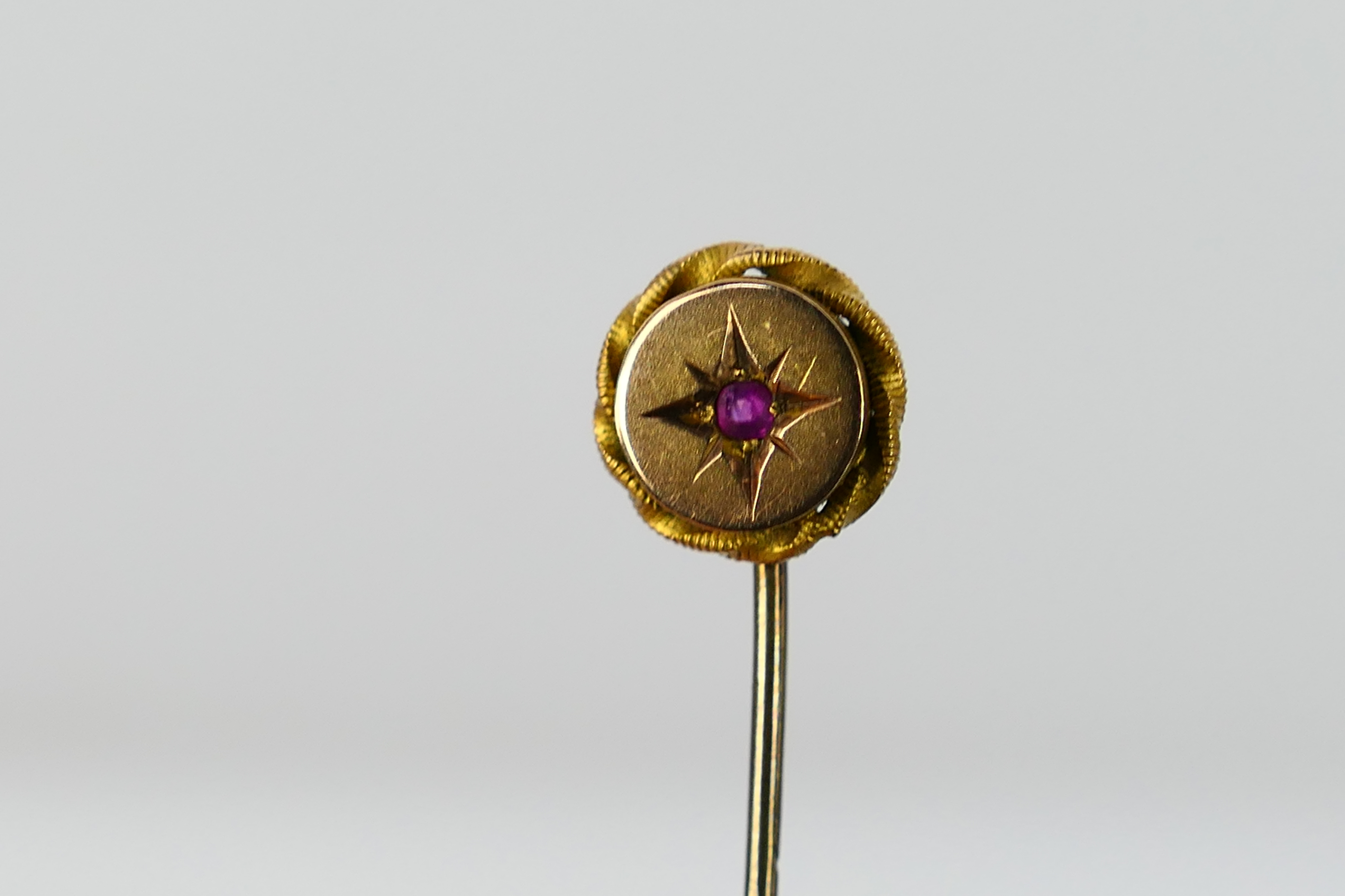 A ruby set stick pin, stamped 9ct, approximately 1.3 grams. - Image 2 of 3