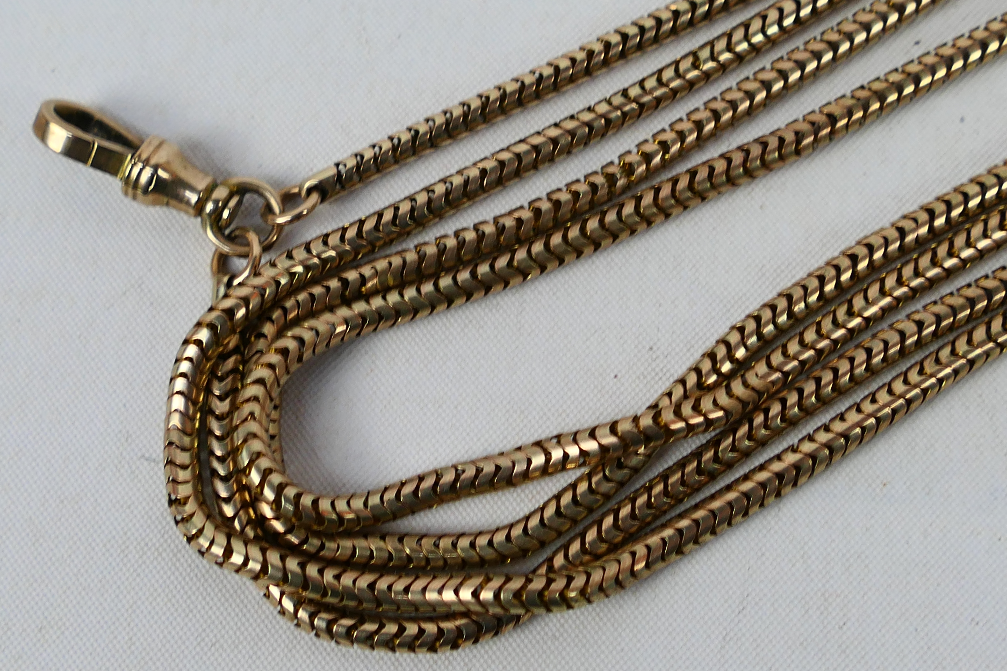 A yellow metal, muff chain and clasp, stamped 9c, 156 cm (l), approximately 44 grams all in. - Image 3 of 4