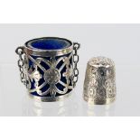 An Edwardian silver chatelaine thimble case with pierced and chased decoraction,