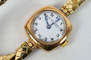 A 9ct gold cased wrist watch, the dial signed Thomas Russell & Son, Arabic numerals to a white dial,