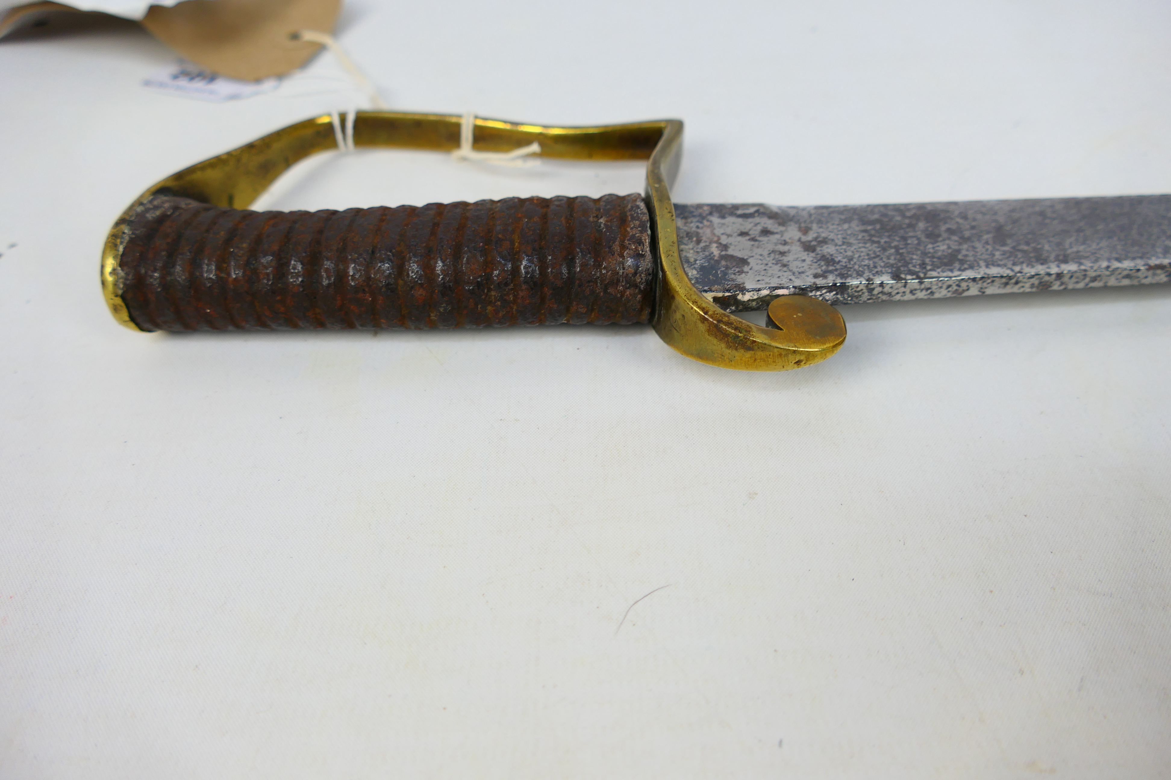 An 1896 pattern Mountain Artillery Sabre style sword, brass stirrup hilt and ribbed iron grip. - Image 6 of 7
