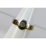 A two tone yellow and white metal stone set ring, stamped 750 for 18ct, size O+½, approximately 2.