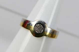 A two tone yellow and white metal stone set ring, stamped 750 for 18ct, size O+½, approximately 2.