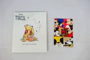 Two limited edition Disney related coin sets comprising Winnie The Pooh Official Collector Pack