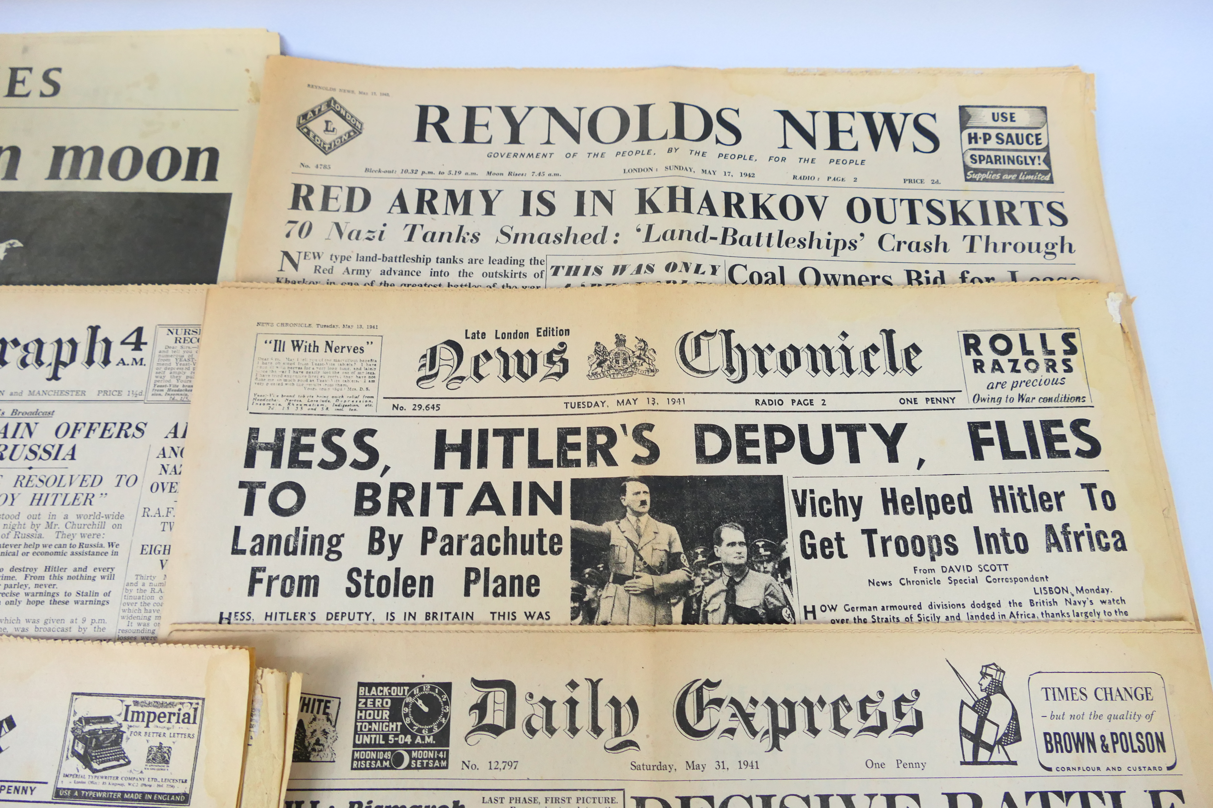 A collection of vintage newspapers with front pages detailing historically significant events to - Image 6 of 6