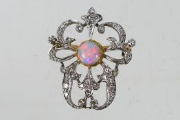 A diamond and opal pendant / brooch, 3 cm (l), approximately 5.7 grams.