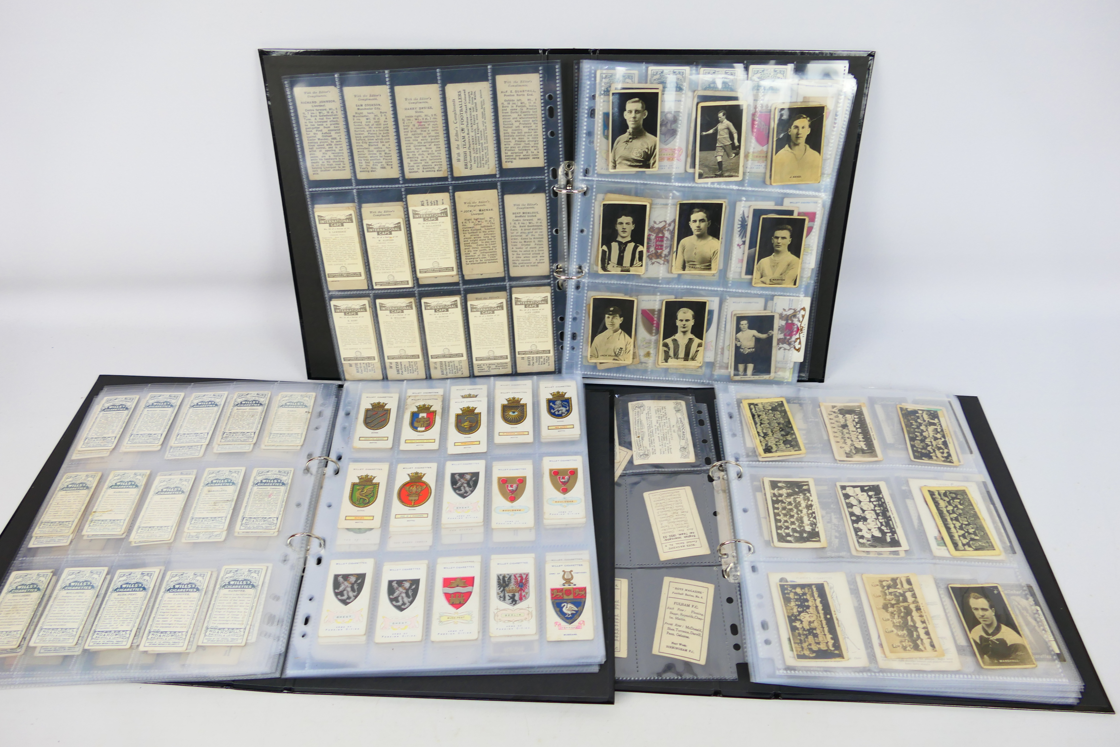 Three binders of cigarette and trade cards to include footballers, football teams, steam ships,