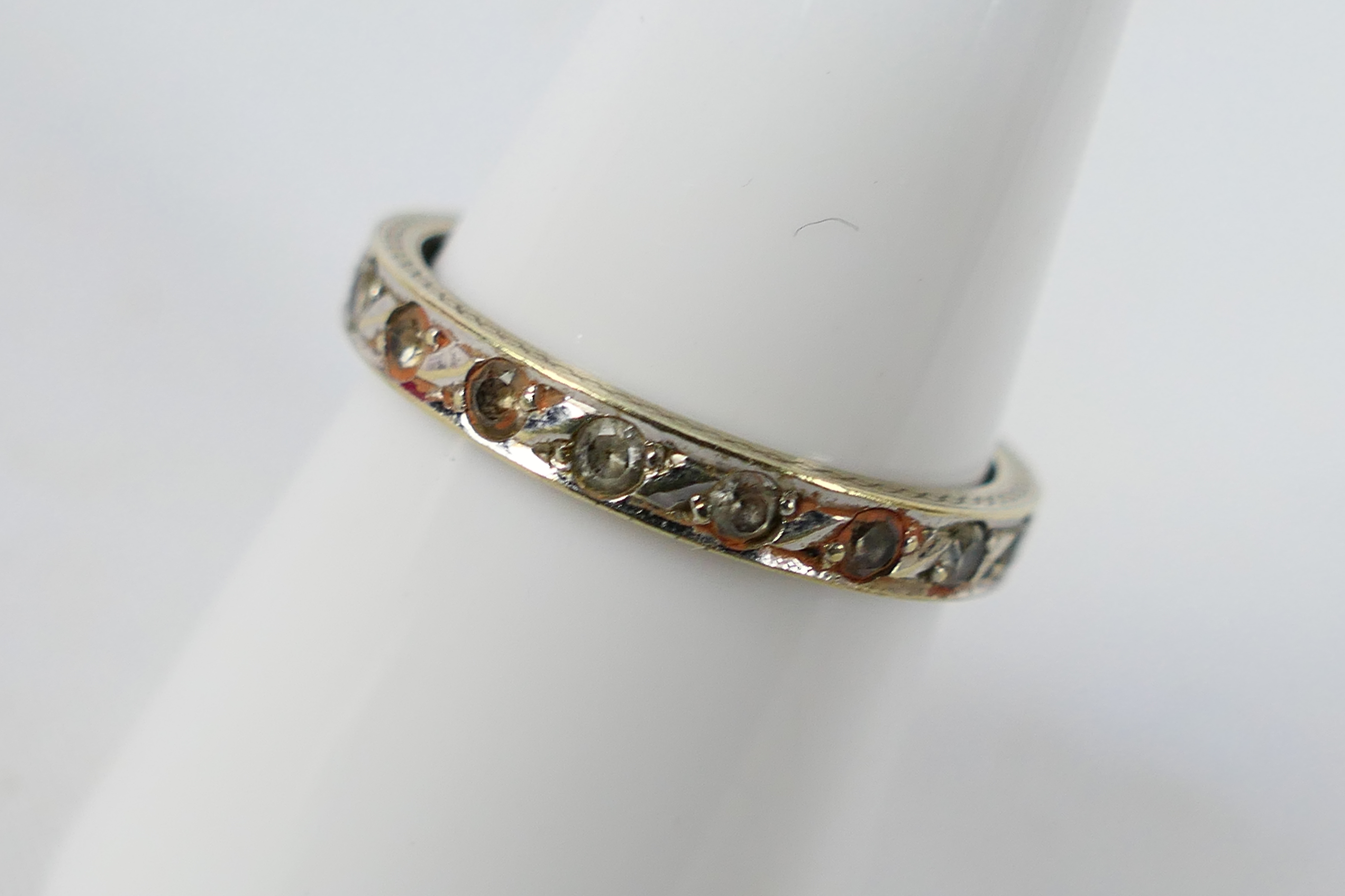 A white metal, diamond set eternity ring, marks quite rubbed but appears to be stamped 9ct, - Image 2 of 3