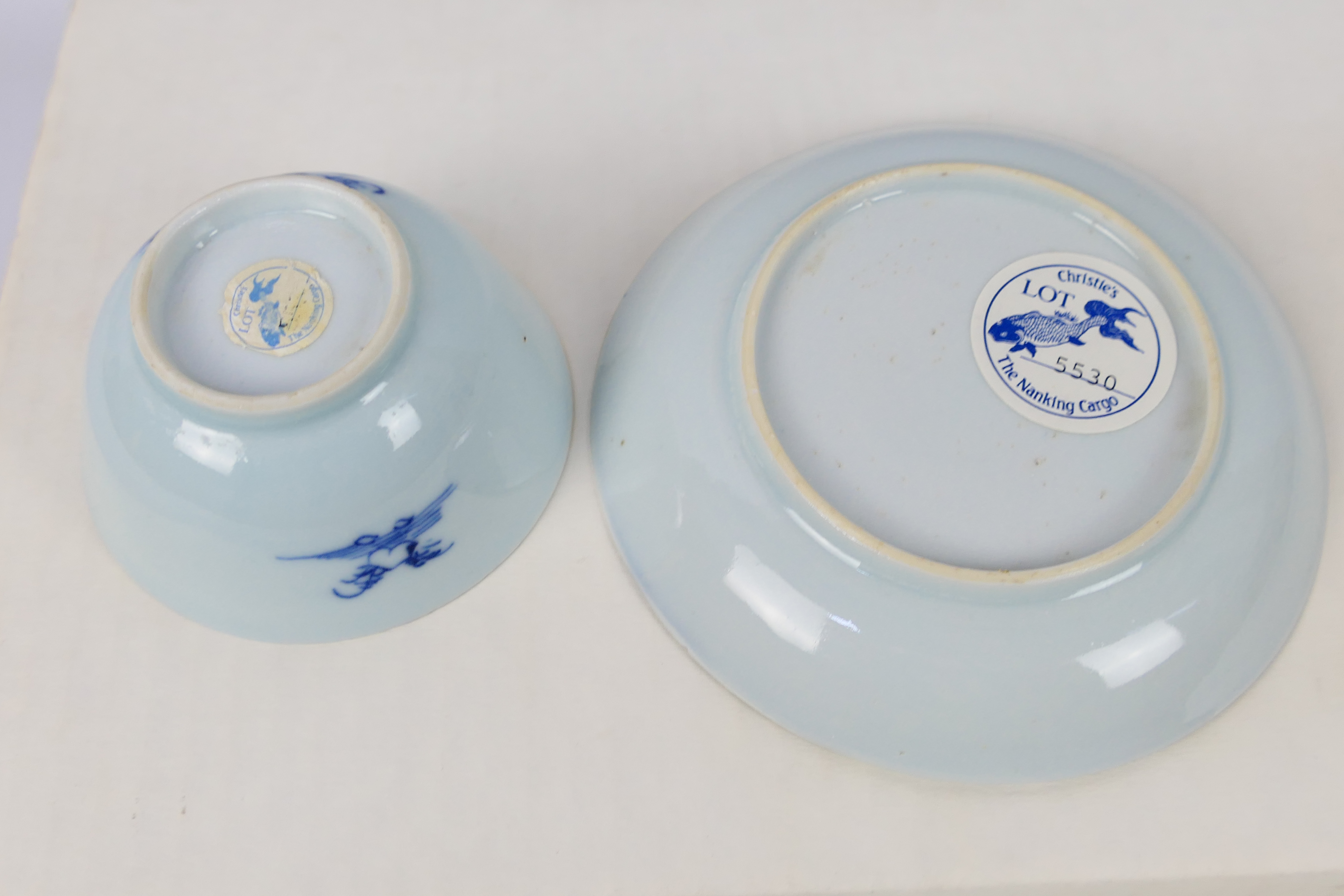 Nanking Cargo - A Qing dynasty blue and white tea bowl and saucer decorated with pine trees, c. - Image 7 of 9