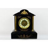 A 19th century black slate mantel clock of architectural form,