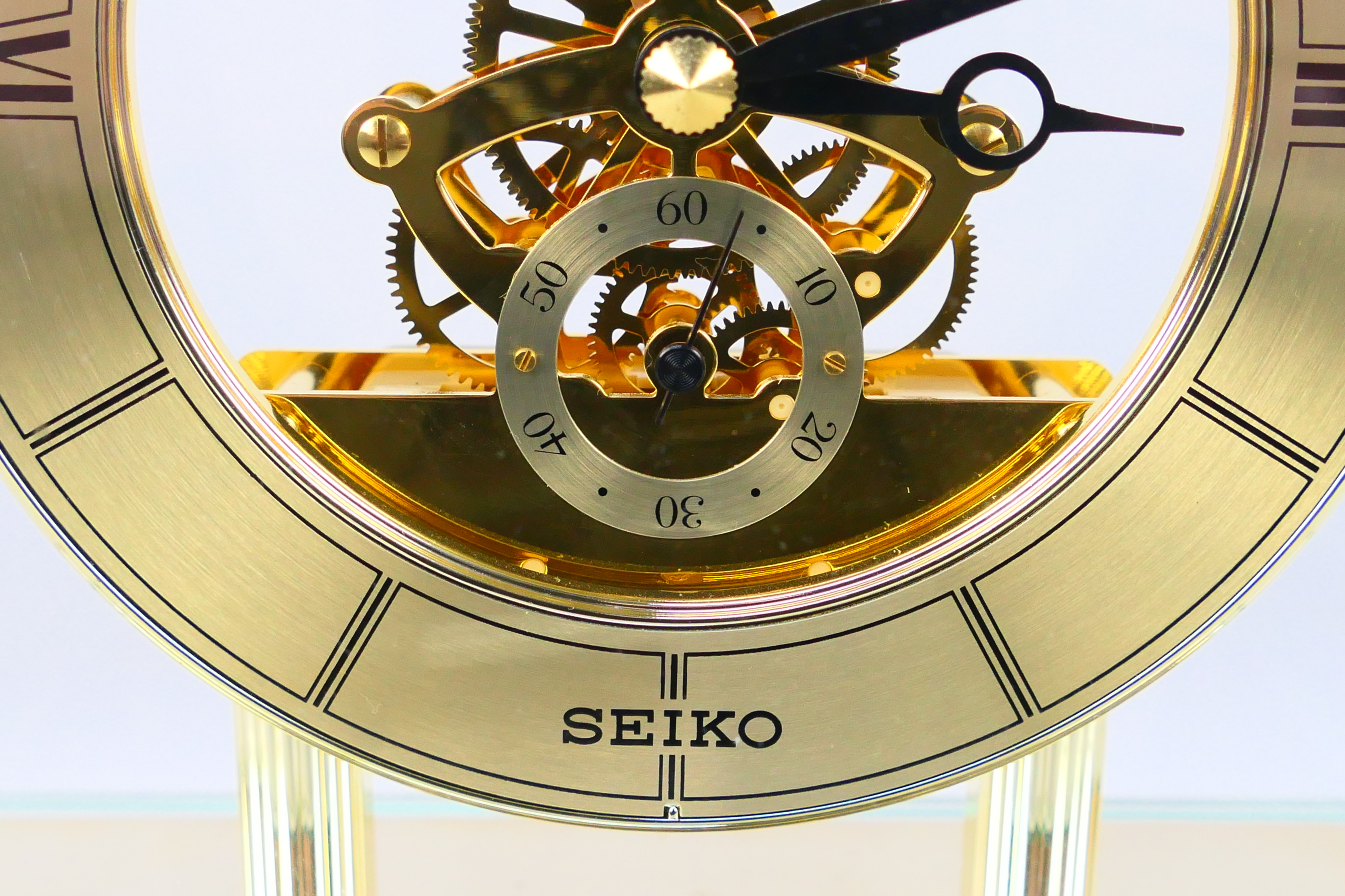 Seiko - A glass cased skeleton clock with quartz movement, 24 cm (h) to top of handle. - Image 3 of 6