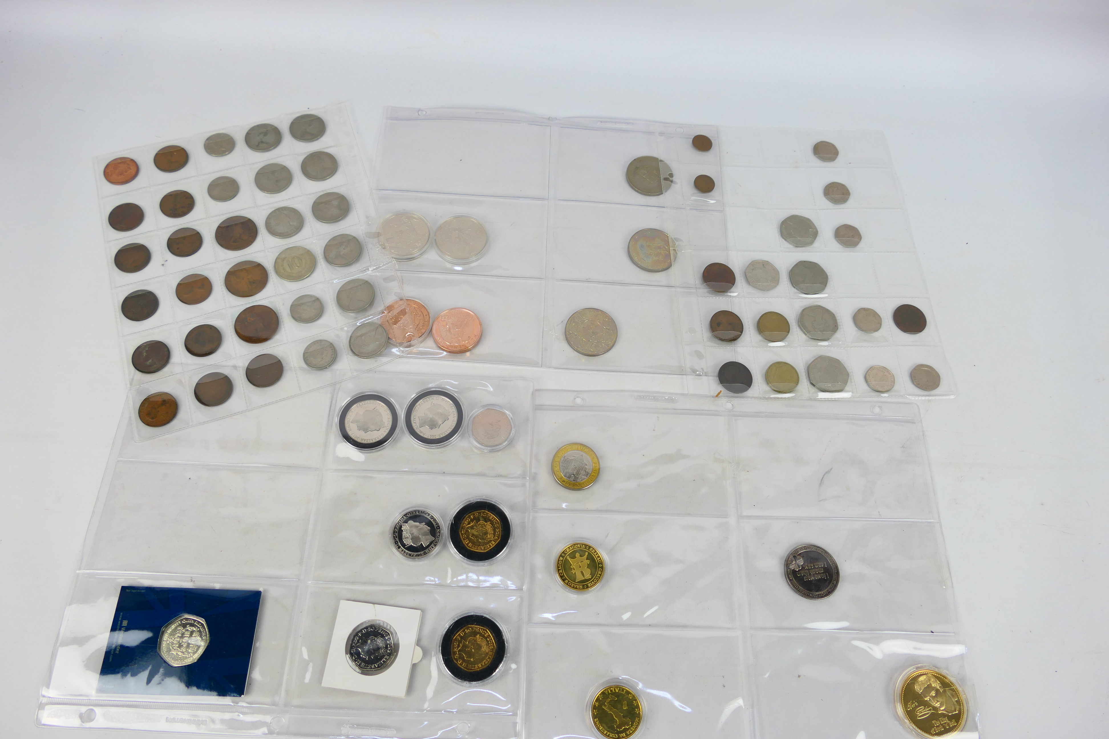 A collection of UK and foreign coins to include collectable fifty pence (50p) examples and other. - Image 10 of 10