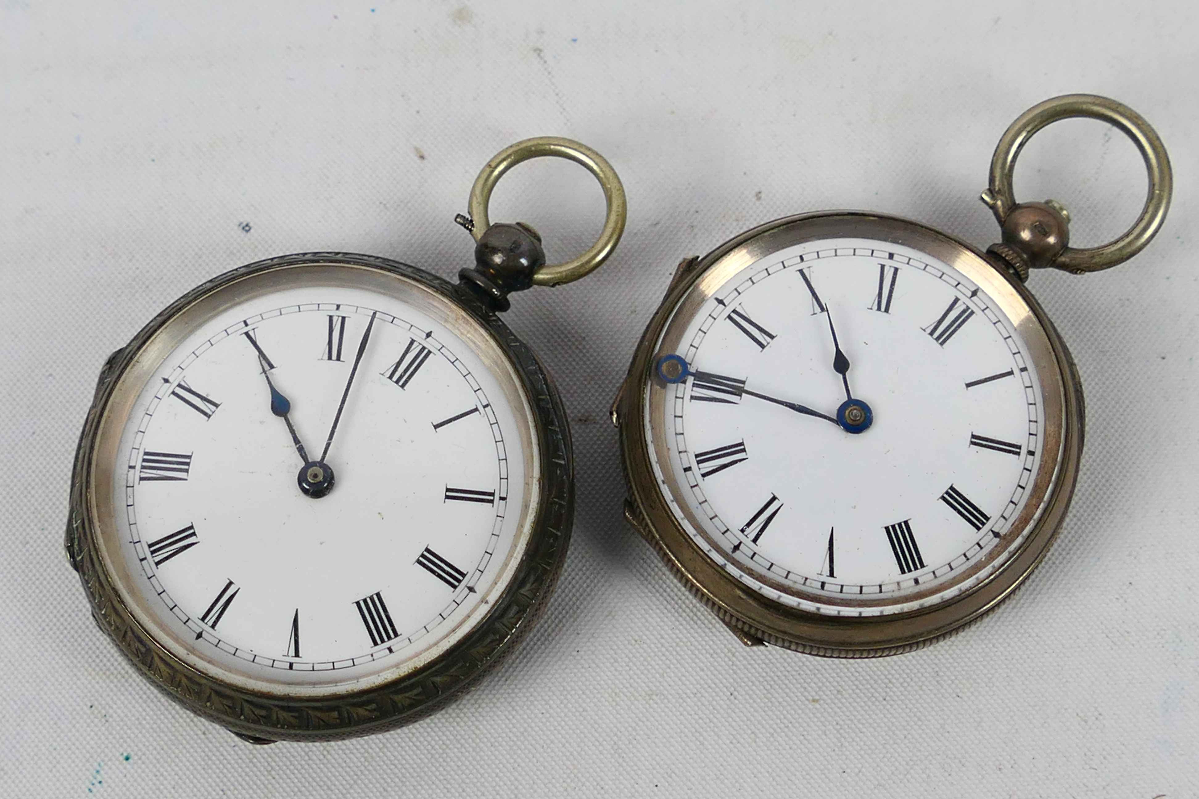 Two Swiss silver cased (one 935 fineness and one 800), open face pocket watches,