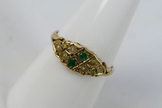 A vintage 9ct yellow gold ring set with emerald and pearl, size O+½, approximately 2 grams.