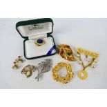 An attractive set of 12k gold filled and faux opal jewellery comprising brooch and ear clips and a