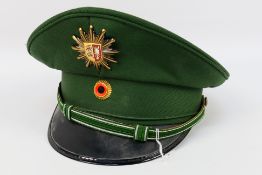 A German green police hat. The hat which